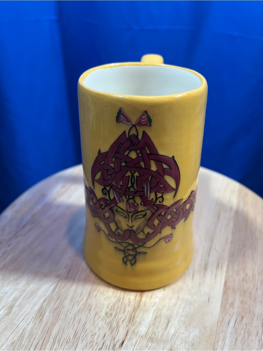 Yellow Ceramic Mug with Celtic Knot & Mask Design